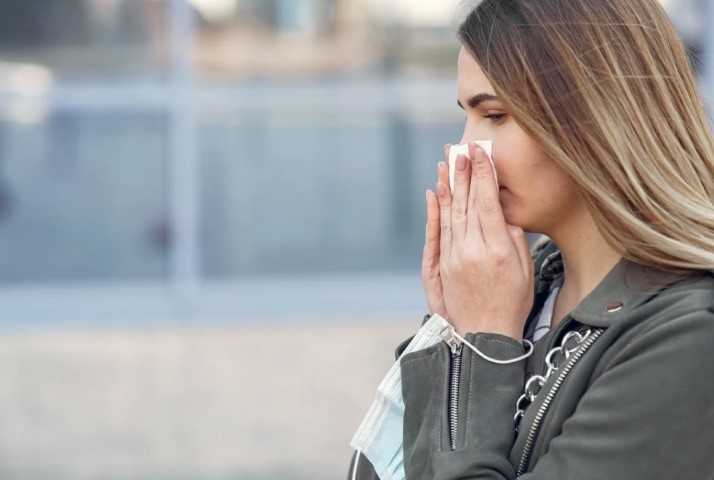 Girl flu with tissue